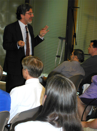 photo: Howard Strauss exchanges portal ideas with attendees of the Portal Symposium Workshop