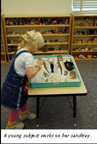 photo of a child working in a sand tray